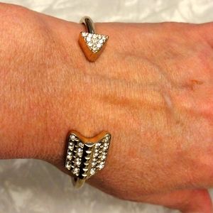 Beautiful faux gold and diamonds wrapped arrow bangle bracelet.